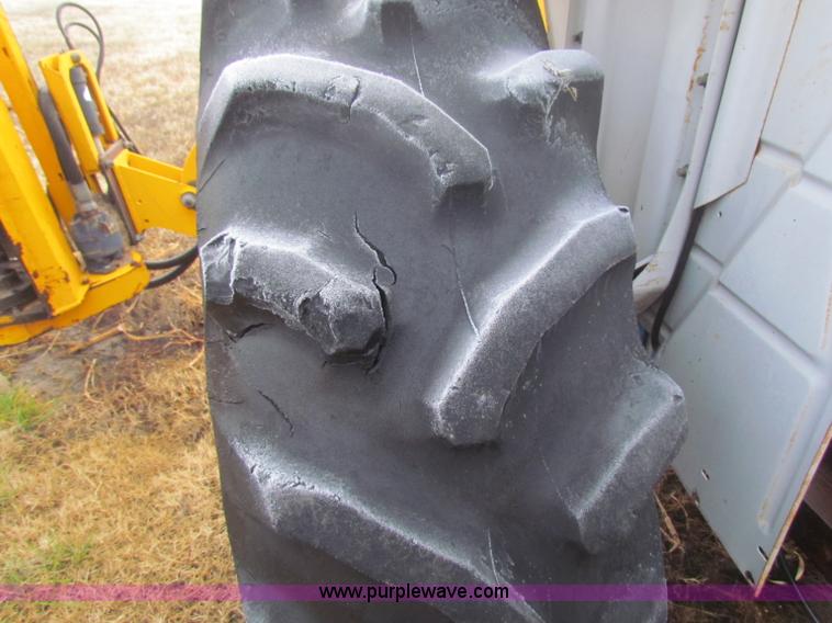 image for item B7018 1986 Ford 5900 tractor with flail boom mower