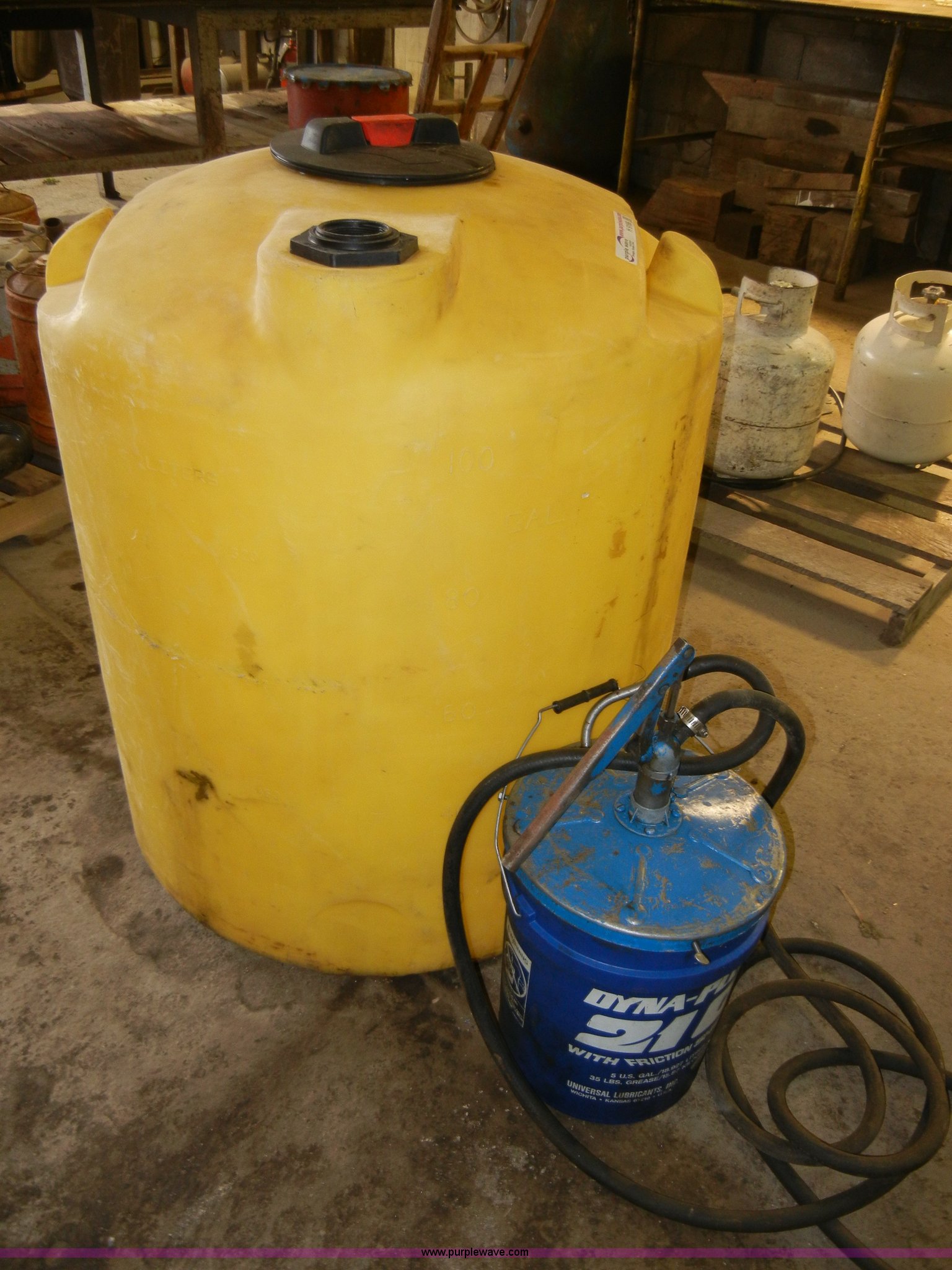 100 gallon vertical storage tank with five gallon lube pump in Lawrence