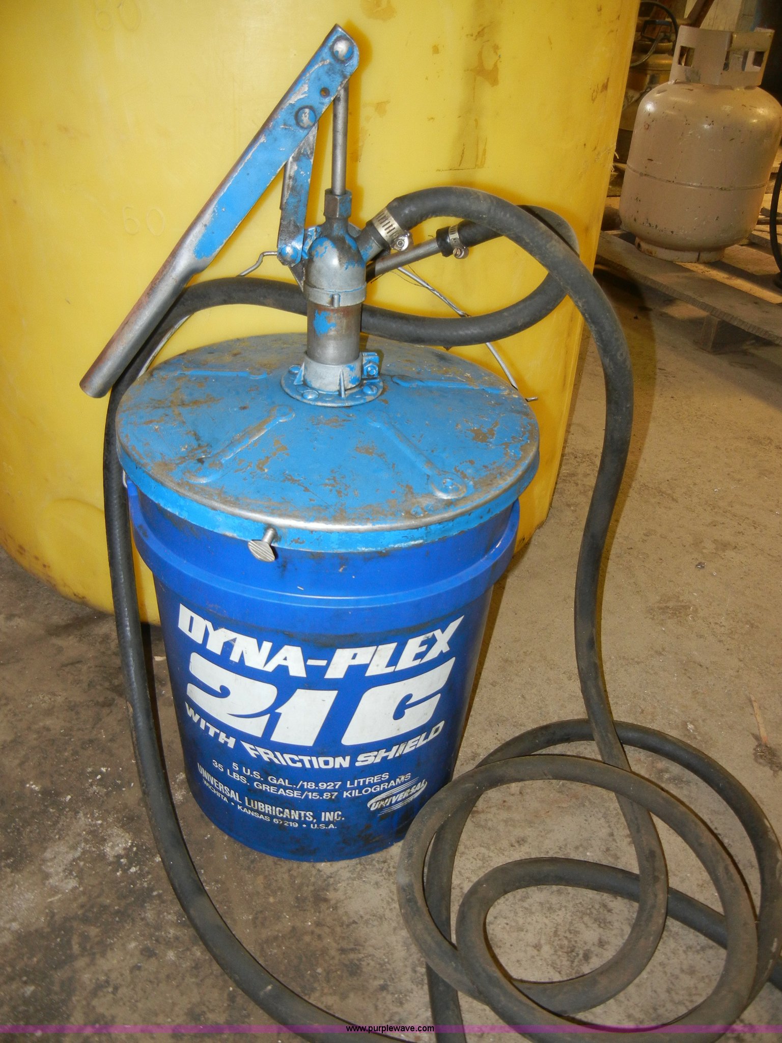 100 gallon vertical storage tank with five gallon lube pump in Lawrence