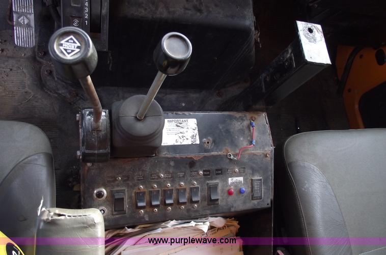 image for item C5819 2000 International 4900 dump truck with plow and spreader