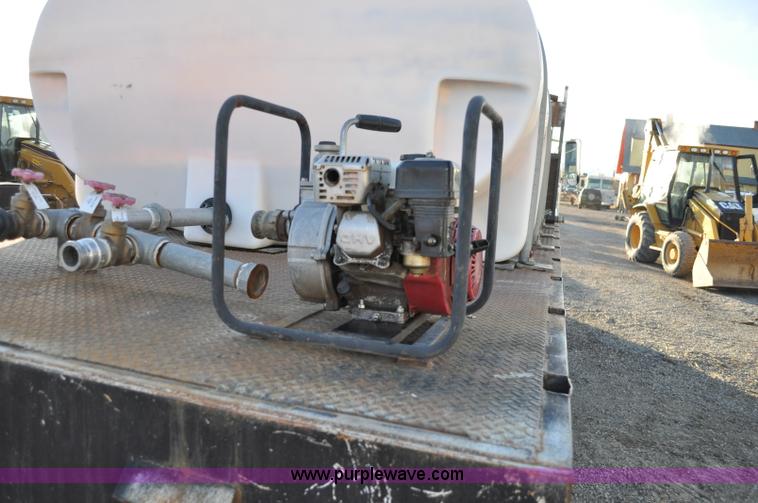 image for item A5717 1993 Ford F800 flatbed truck with tank