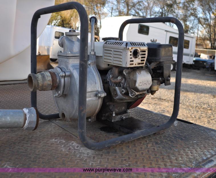 image for item A5717 1993 Ford F800 flatbed truck with tank