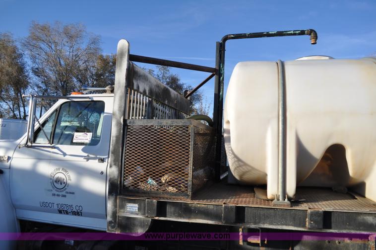 image for item A5717 1993 Ford F800 flatbed truck with tank