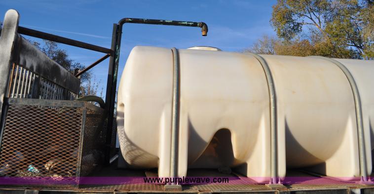 image for item A5717 1993 Ford F800 flatbed truck with tank