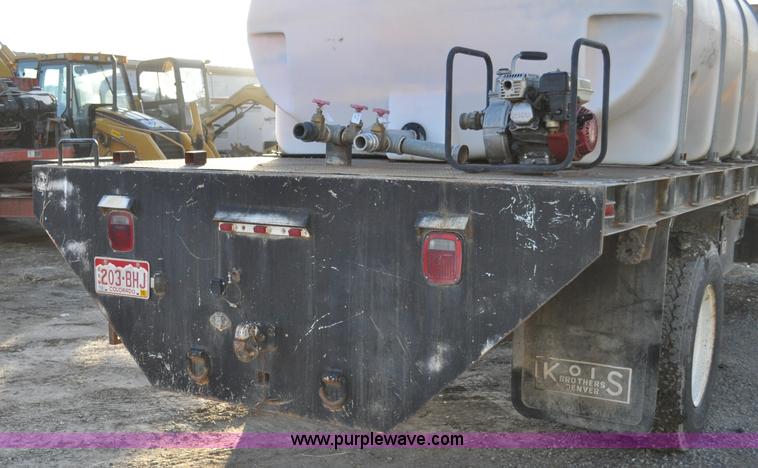 image for item A5717 1993 Ford F800 flatbed truck with tank