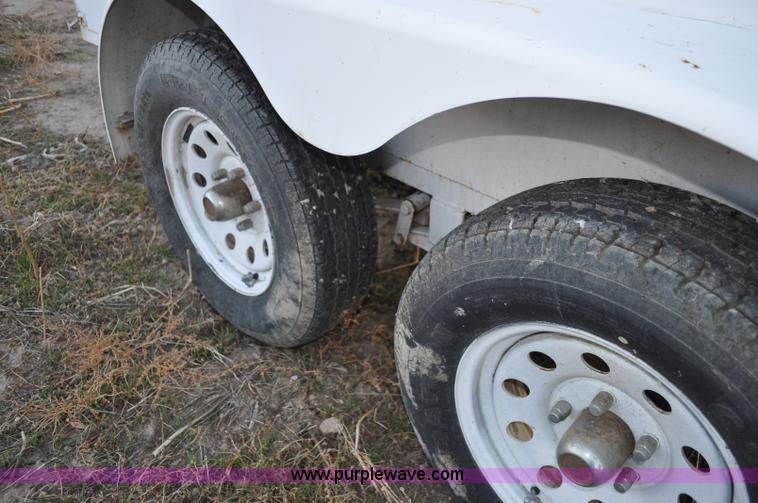 image for item A5735 2001 Justin C tandem axle trailer