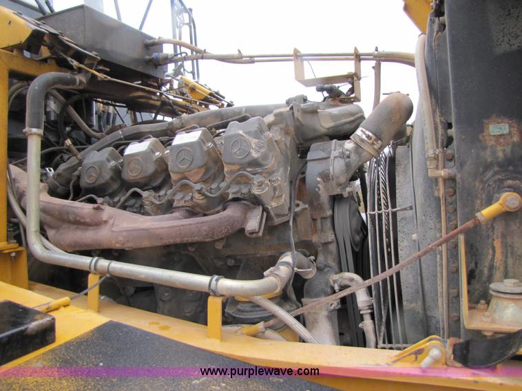 image for item B2110 2000 John Deere 350C 6x6 articulating dump truck