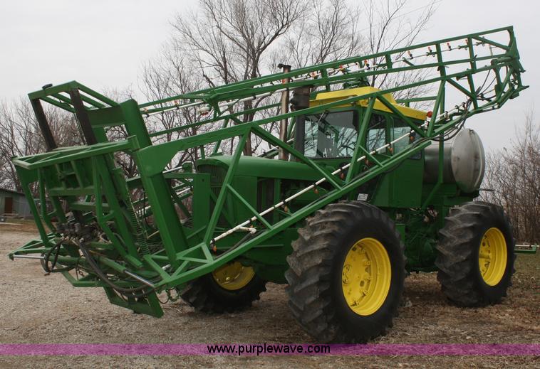image for item A6560 John Deere 7520 shop built sprayer