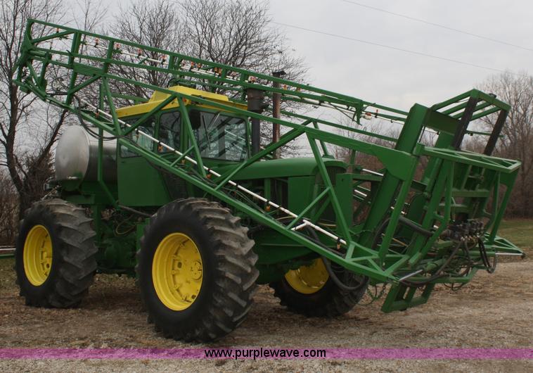 image for item A6560 John Deere 7520 shop built sprayer