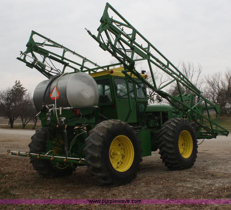 image for item A6560 John Deere 7520 shop built sprayer