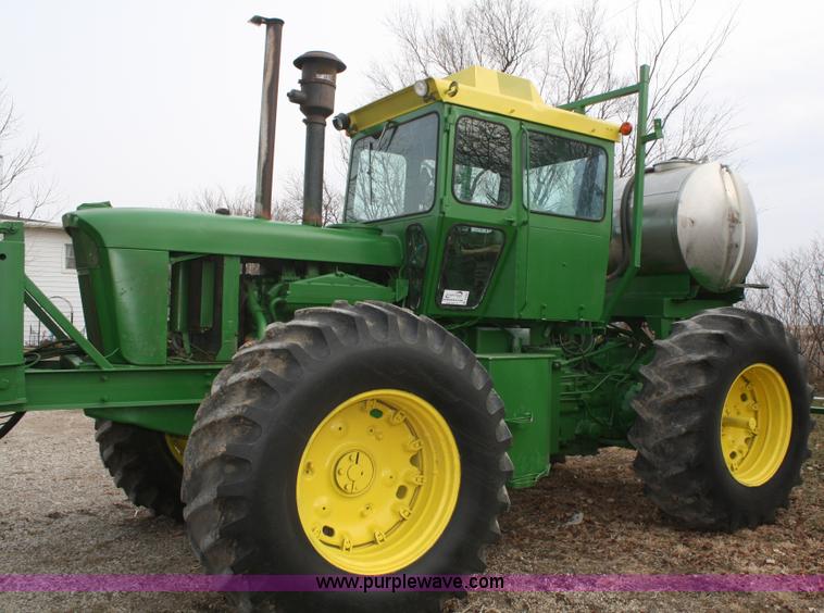image for item A6560 John Deere 7520 shop built sprayer