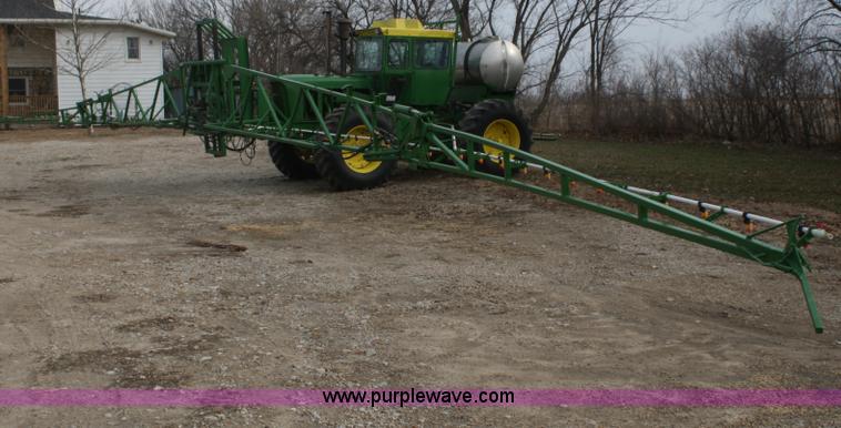 image for item A6560 John Deere 7520 shop built sprayer
