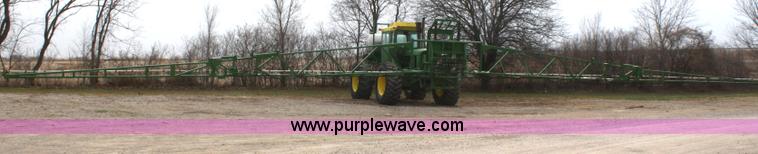 image for item A6560 John Deere 7520 shop built sprayer