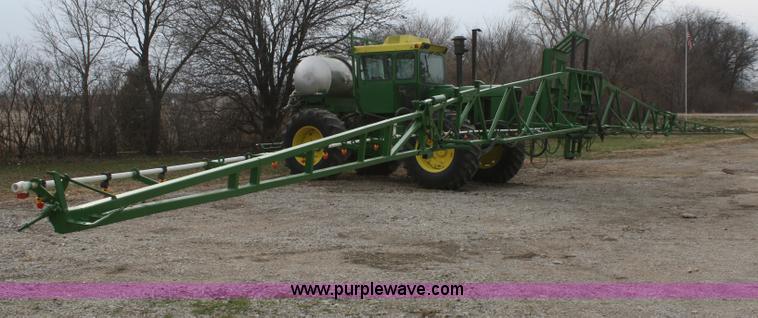 image for item A6560 John Deere 7520 shop built sprayer