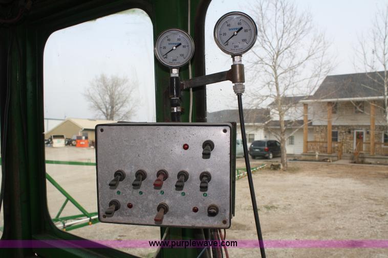 image for item A6560 John Deere 7520 shop built sprayer