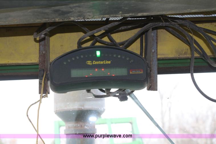 image for item A6560 John Deere 7520 shop built sprayer