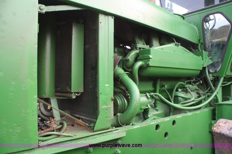 image for item A6560 John Deere 7520 shop built sprayer