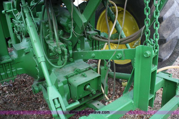 image for item A6560 John Deere 7520 shop built sprayer