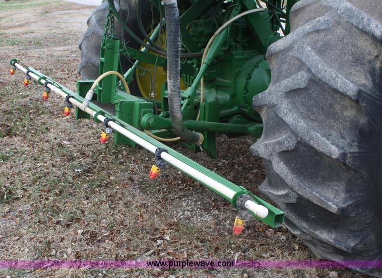 image for item A6560 John Deere 7520 shop built sprayer