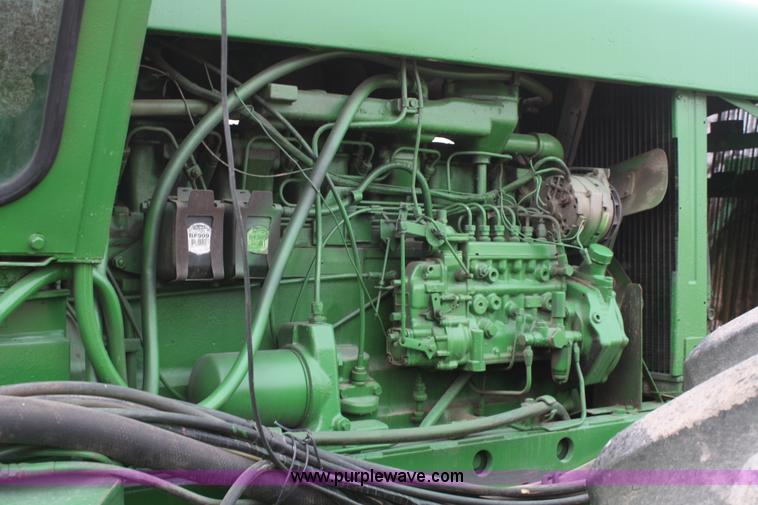 image for item A6560 John Deere 7520 shop built sprayer