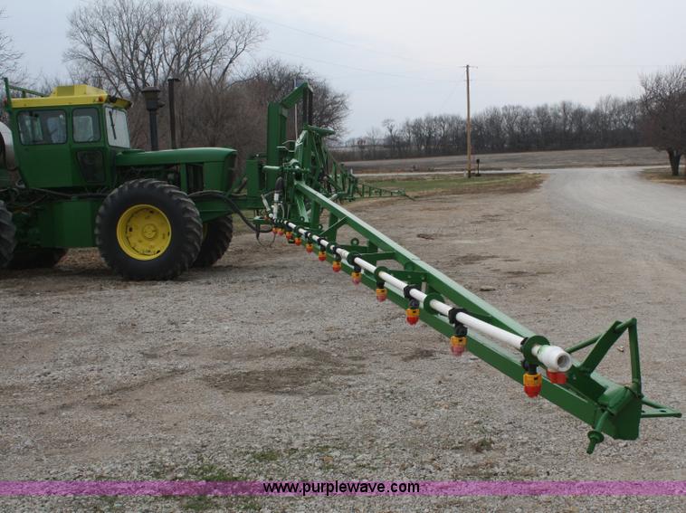 image for item A6560 John Deere 7520 shop built sprayer