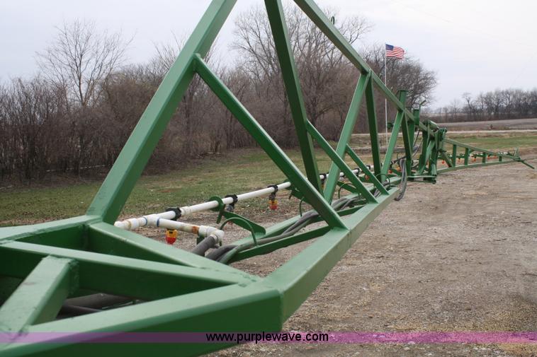 image for item A6560 John Deere 7520 shop built sprayer
