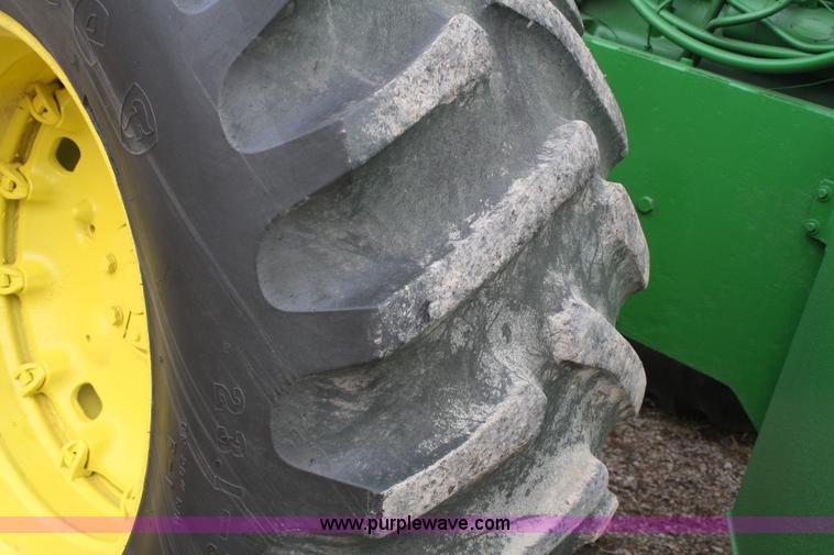 image for item A6560 John Deere 7520 shop built sprayer