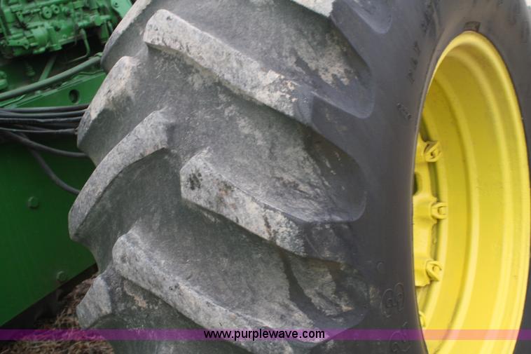 image for item A6560 John Deere 7520 shop built sprayer