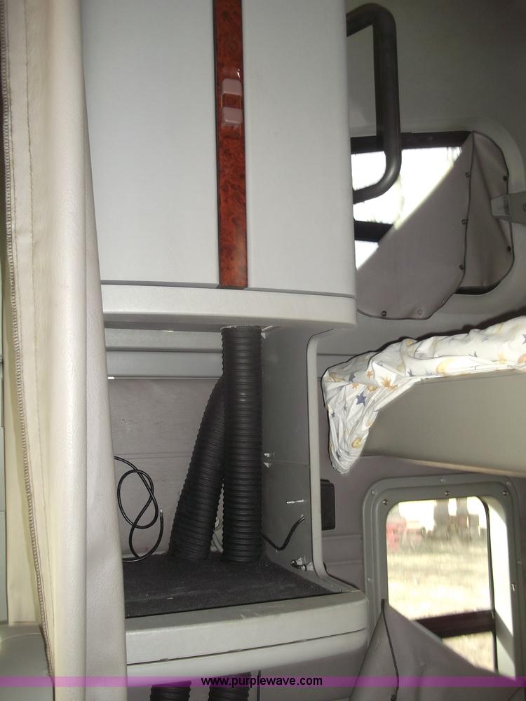 image for item B5076 2004 Freightliner ST120 semi truck