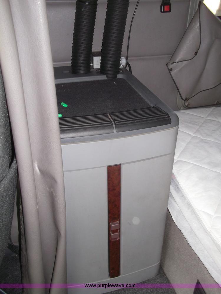 image for item B5076 2004 Freightliner ST120 semi truck