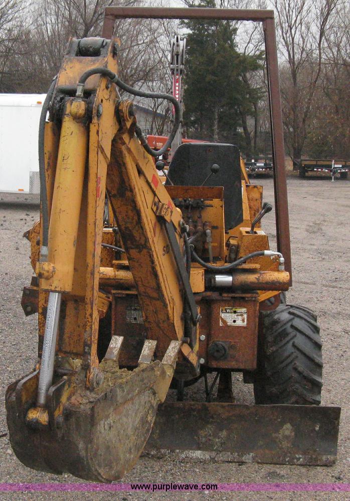 image for item A6015 Case 360 articulating trencher with backhoe attachment