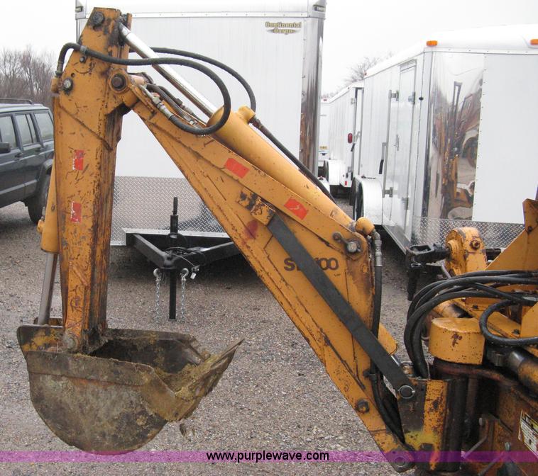 image for item A6015 Case 360 articulating trencher with backhoe attachment