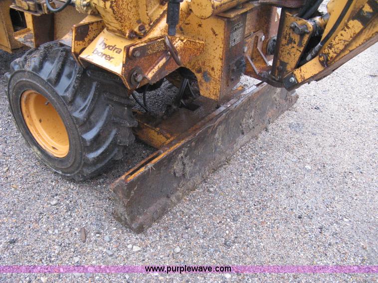 image for item A6015 Case 360 articulating trencher with backhoe attachment