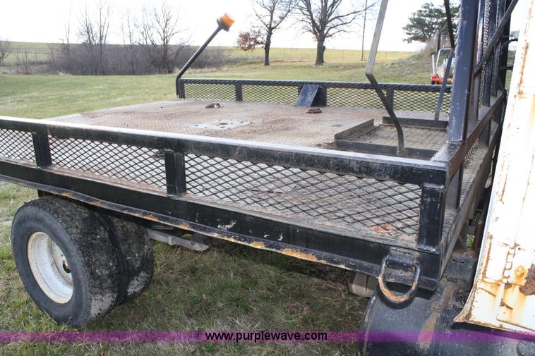 image for item A6612 1998 Isuzu NPR flatbed truck