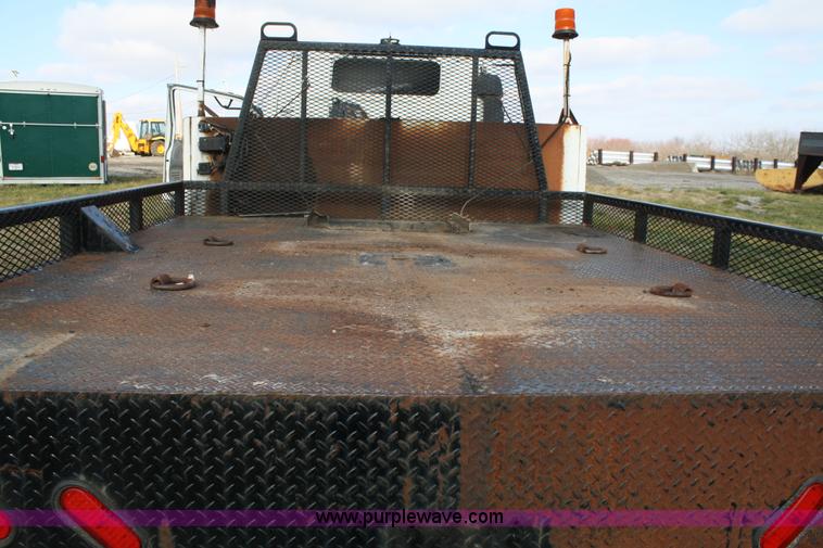 image for item A6612 1998 Isuzu NPR flatbed truck