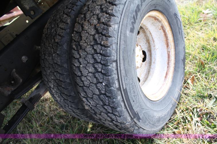 image for item A6612 1998 Isuzu NPR flatbed truck