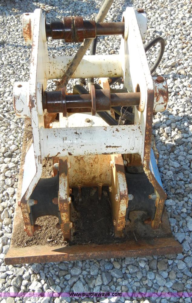 image for item H9241 Kent KHP65 hydraulic packer backhoe attachment