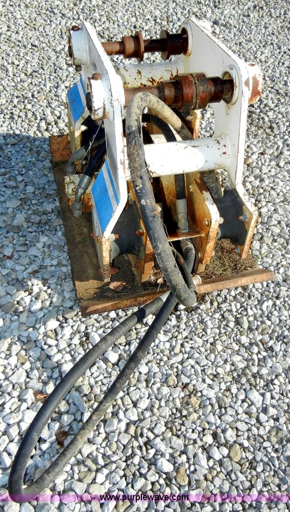 image for item H9241 Kent KHP65 hydraulic packer backhoe attachment