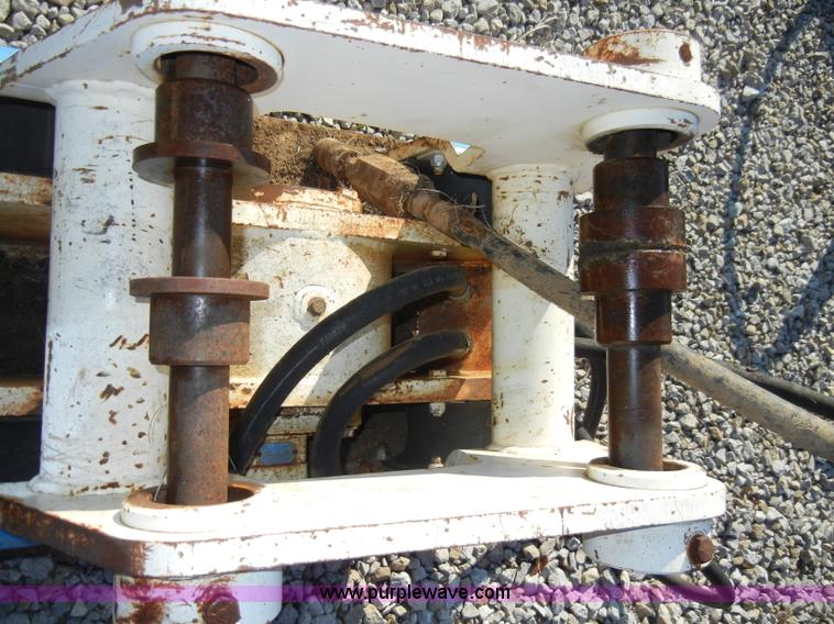 image for item H9241 Kent KHP65 hydraulic packer backhoe attachment