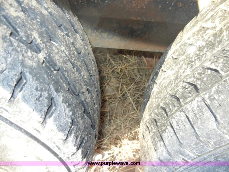 image for item A3383 2000 Titan 30' flatbed gooseneck trailer