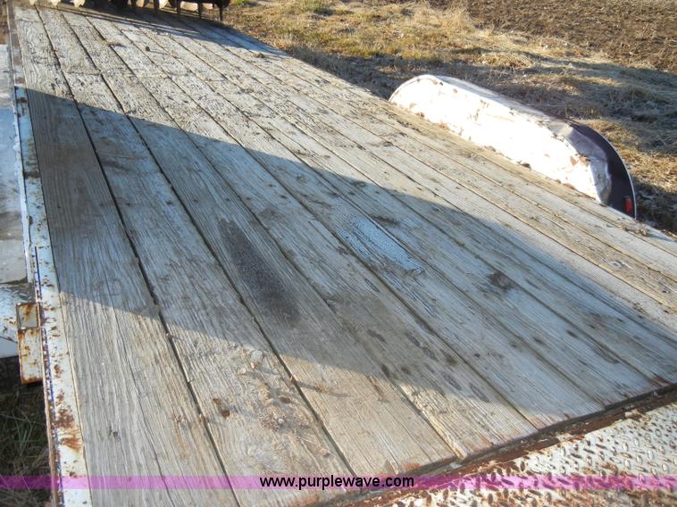 image for item A3383 2000 Titan 30' flatbed gooseneck trailer