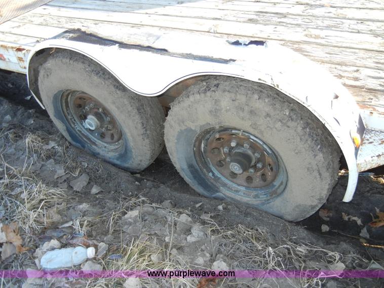 image for item A3383 2000 Titan 30' flatbed gooseneck trailer