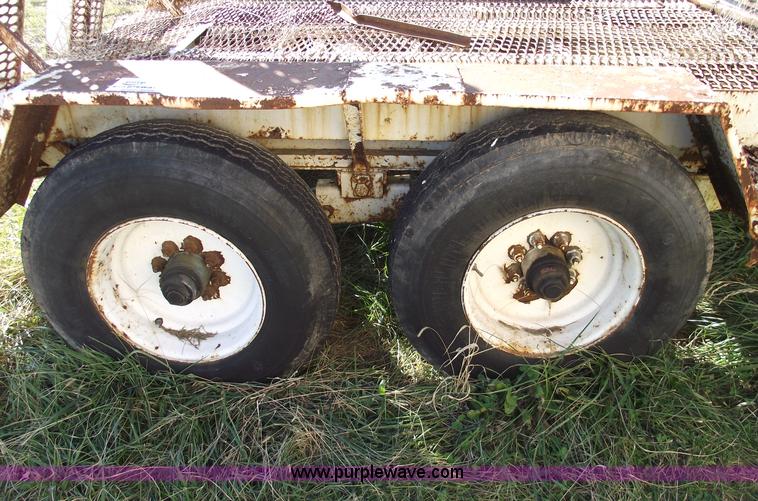 image for item B6041 (2) 20,000 lb axles with wheels and tires