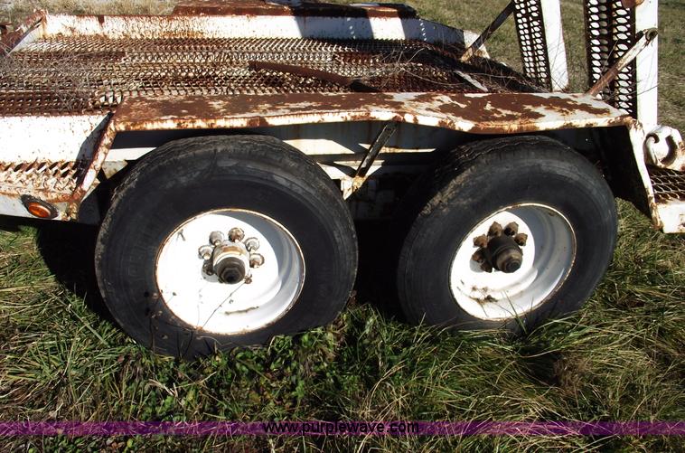 image for item B6041 (2) 20,000 lb axles with wheels and tires