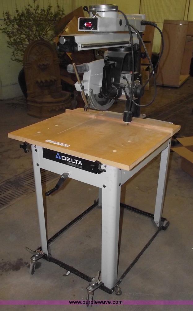 image for item E9528 Delta industrial radial arm saw and assorted tools