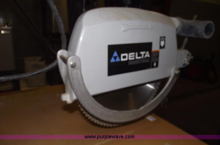 image for item E9528 Delta industrial radial arm saw and assorted tools