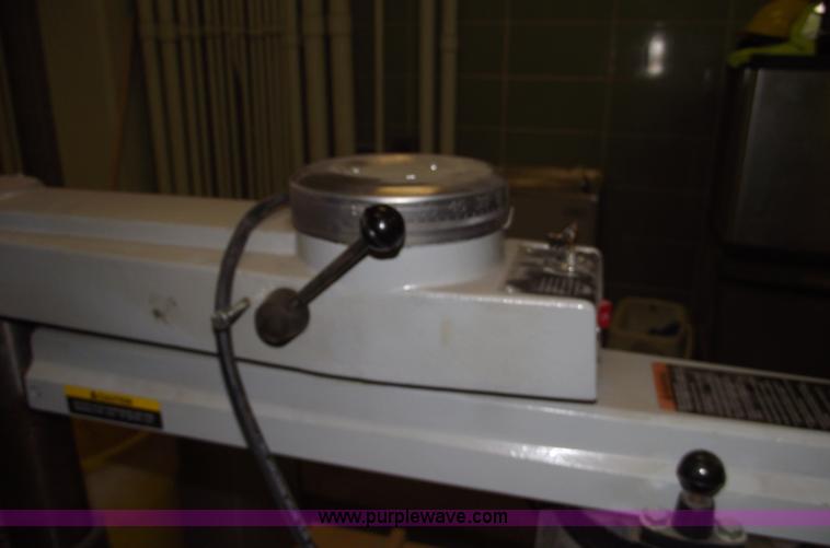 image for item E9528 Delta industrial radial arm saw and assorted tools