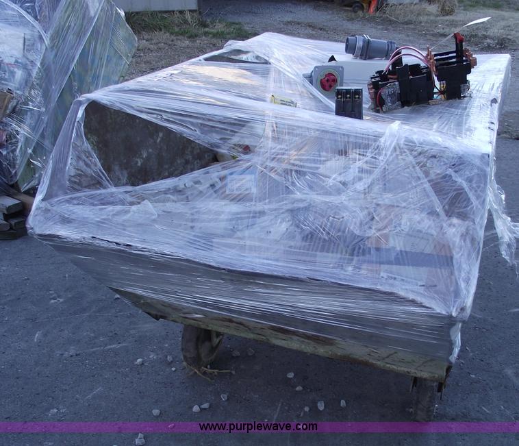 image for item E9565 Dump cart full of assorted industrial electric parts