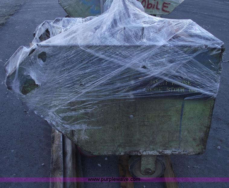 image for item E9569 Three wheel dump cart filled with assorted bearings and seals