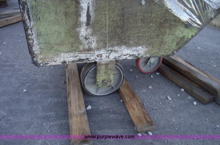 image for item E9569 Three wheel dump cart filled with assorted bearings and seals